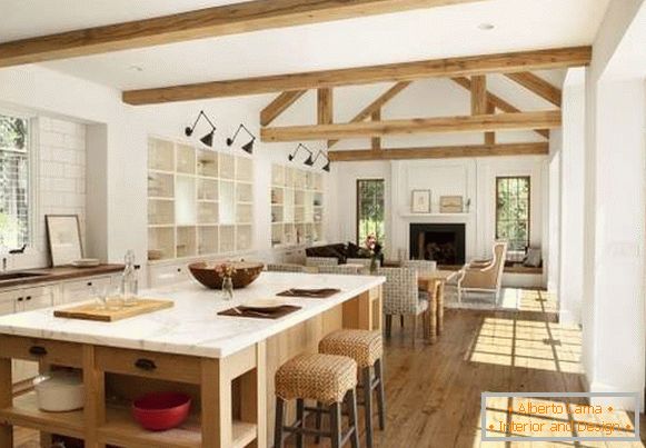 Дизайн інтер'єру заміського будинку - фото суміщеної кухні з вітальні