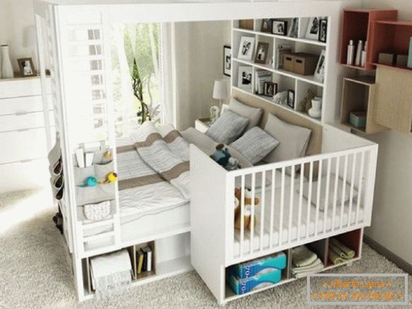 сучасний інтер'єр спальні з приставних дитячим ліжечком