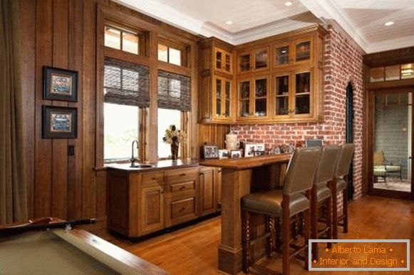 Дизайн кухні з цегляною стіною і дерев'яною обробкою