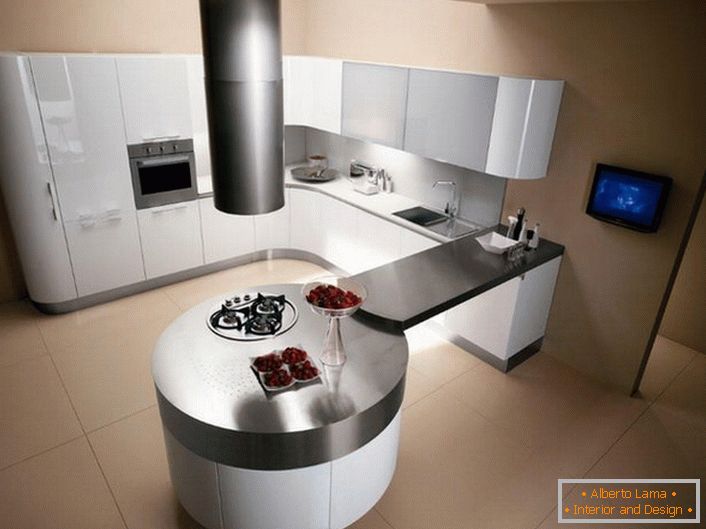 Кухня в стилі мінімалізм відрізняється використанням чітко окреслених геометричних форм. Даний проект примітний круглим обіднім столом, об'єднаним стільницею з кухонним гарнітуром.