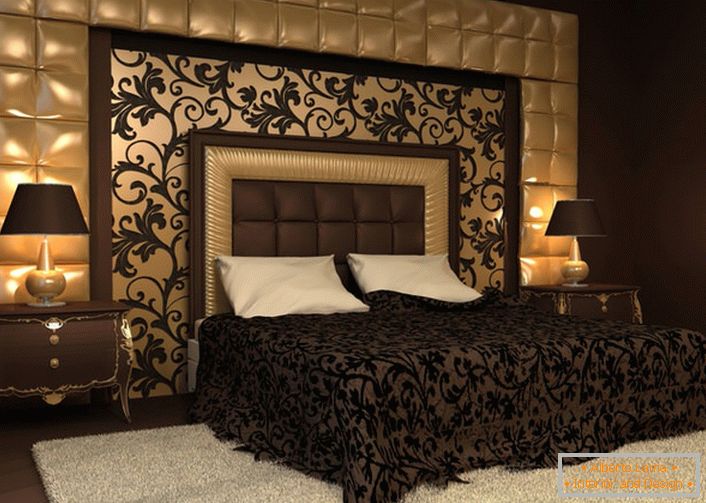Родзинкою дизайнерського рішення стала спинка біля ліжка і стіна, оббиті м'якою тканиною. Орнаменти на покривалі перегукуються з орнаментами на настінному панно. 