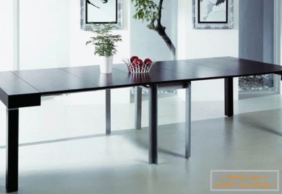 розкладний стіл консоль чорного кольору в дизайні вітальні