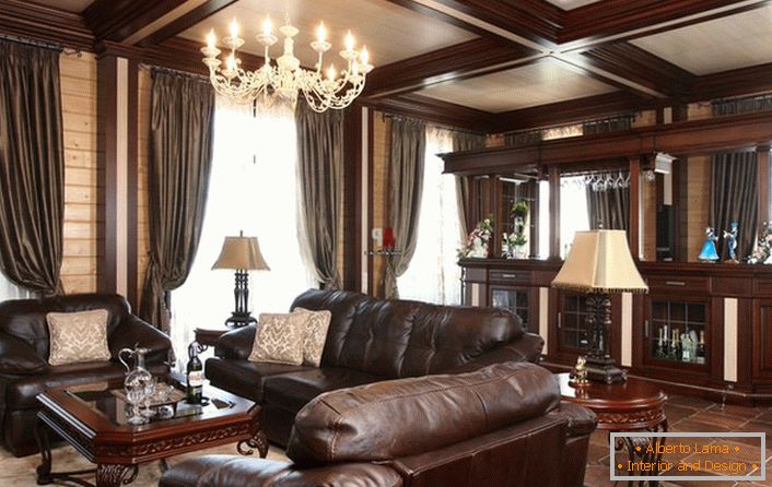 Шикарна кімната для гостей з барною стійкою. Увага притягує масивна м'які меблі, оббиті шкірою. 