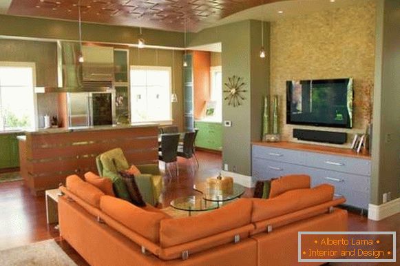 Оранжево зелений інтер'єр кухні вітальні в приватному будинку