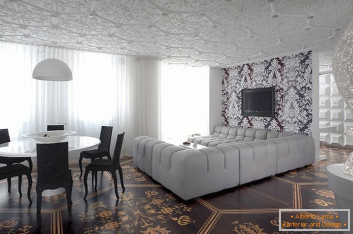 Контраст білого і темно-коричневого кольору у вітальні в модерн стилі. Величезний диван П-подібної форми для тривалих переглядів фільмів і улюблених передач.