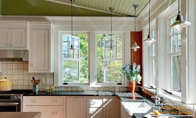 дизайн кухні з кутовим вікном фото