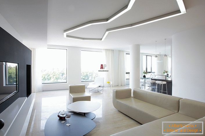 Приклад правильного підбору освітлення для вітальні в стилі мінімалізм. Відповідно до вимог стилю в створенні інтер'єру використовуються геометричні форми і строгі лінії.