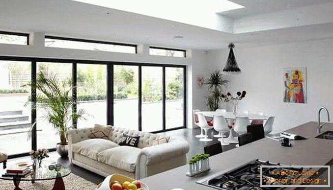 Дизайн квартири студії з панорамними вікнами - фото кухні вітальні