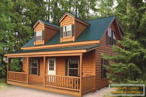 Пофарбовані дерев'яні будинки - фото з зеленим дахом