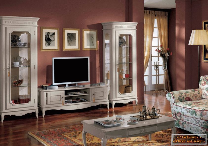 У вітальні використовуються крісла, диван, комод, стінка і журнальні столики