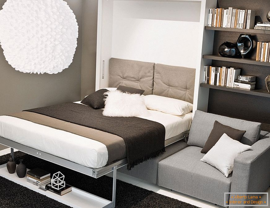 Розкладний диван-ліжко в інтер'єрі вітальні